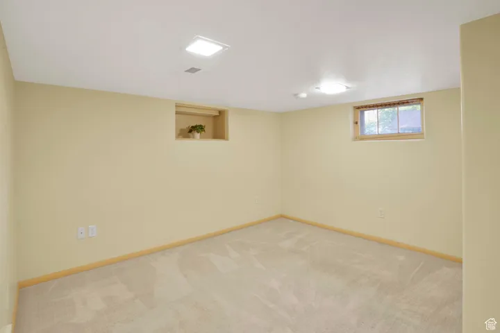 Below grade area with carpet floors and baseboards