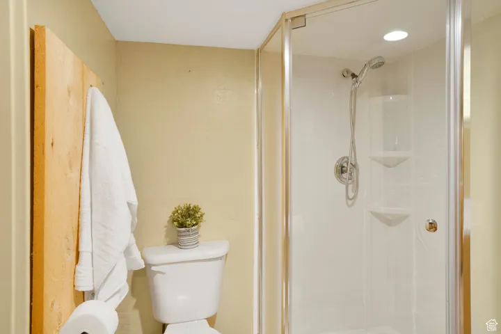 Bathroom featuring a shower stall