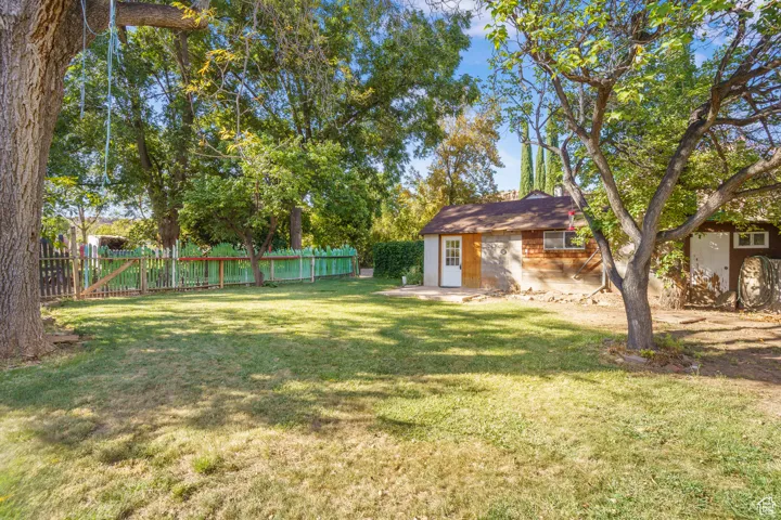 Fenced backyard featuring a patio