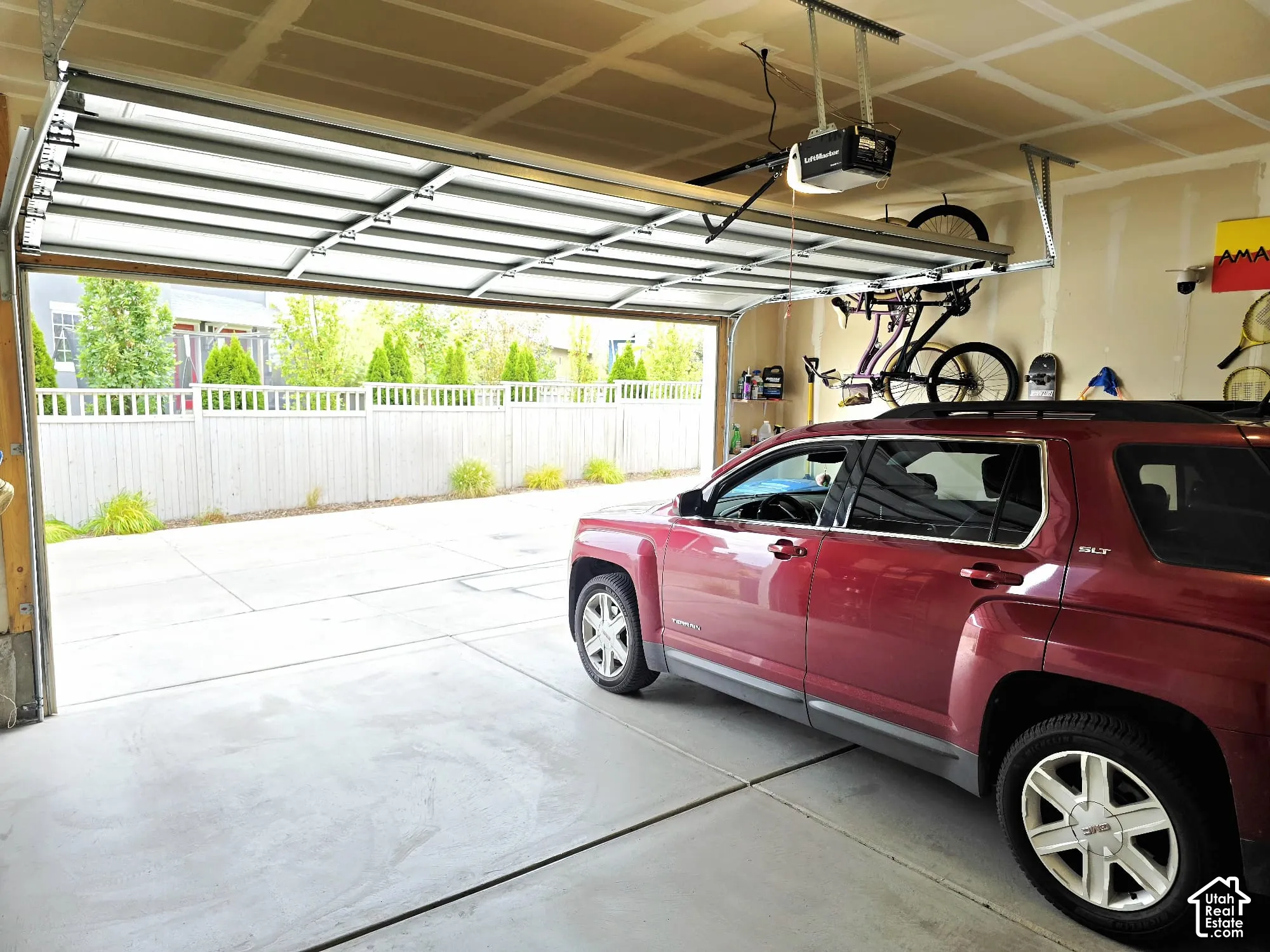 Garage featuring a garage door opener