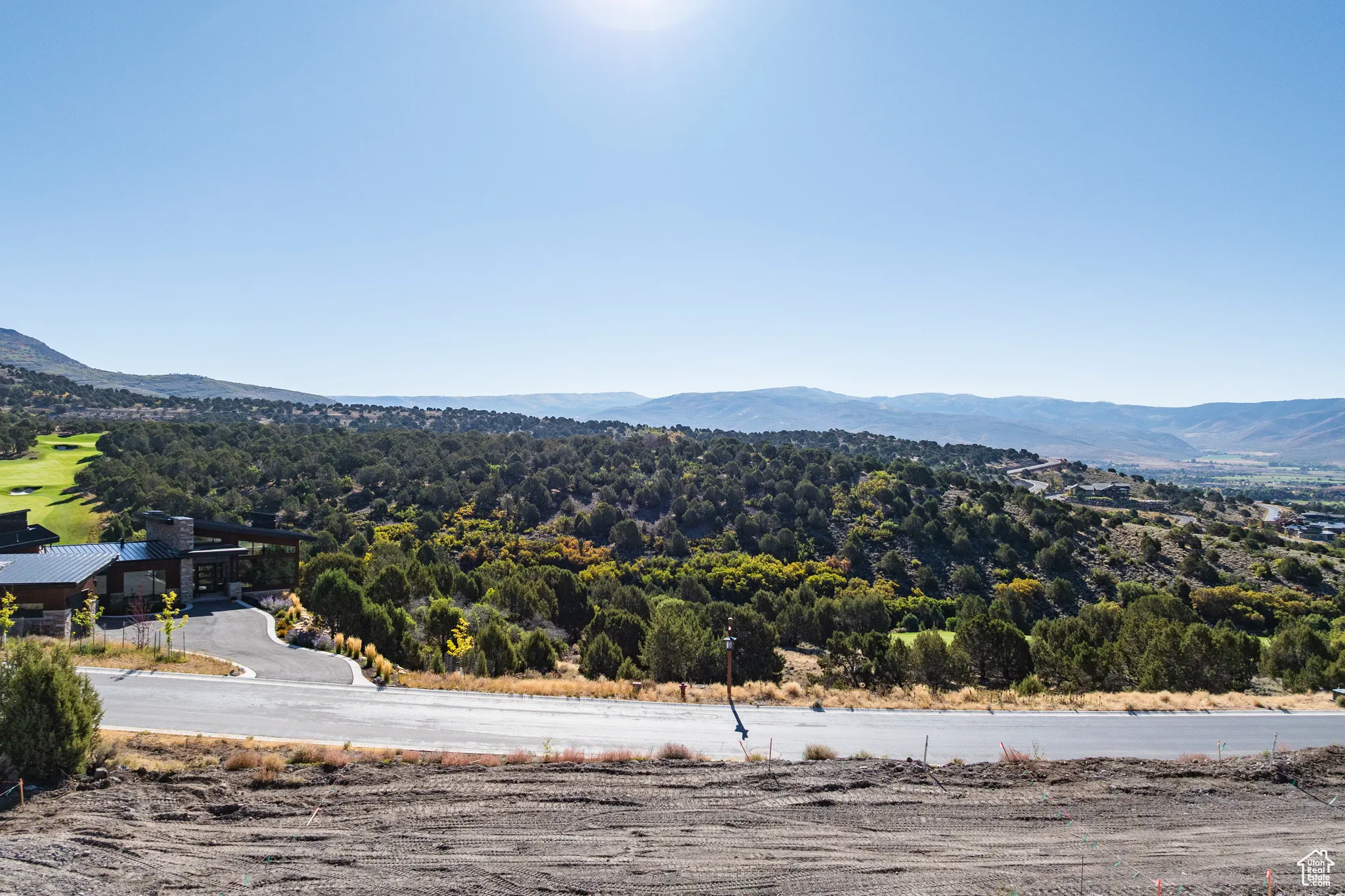 View of mountain background featuring a heavily wooded area