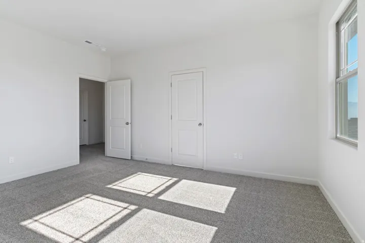 Unfurnished bedroom featuring carpet