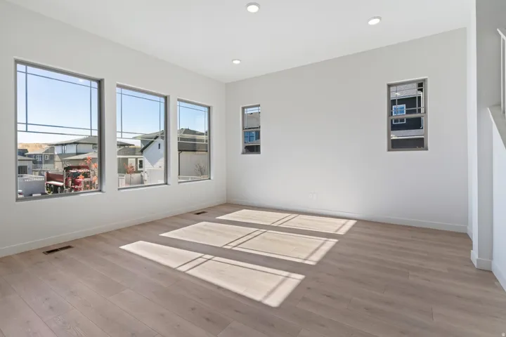 Unfurnished room featuring light wood finished floors and recessed lighting