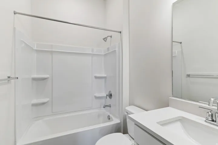 Bathroom with vanity and bathing tub / shower combination