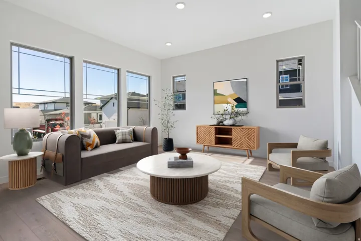 Living room featuring wood finished floors and recessed lighting