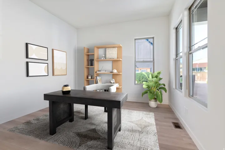Office space with baseboards and light wood-type flooring