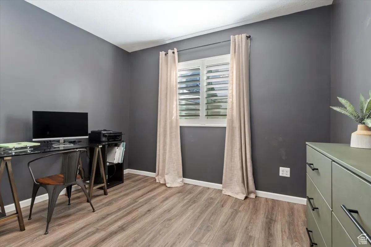 Office area with light wood-style flooring