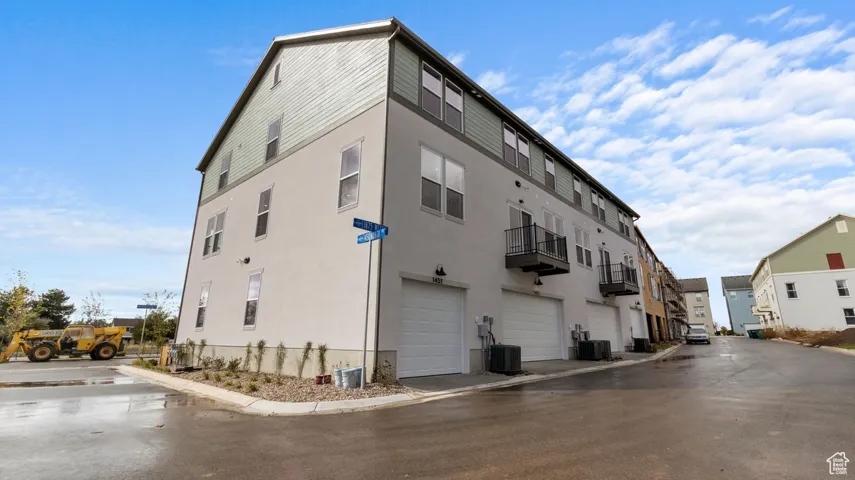 View of building exterior with a garage