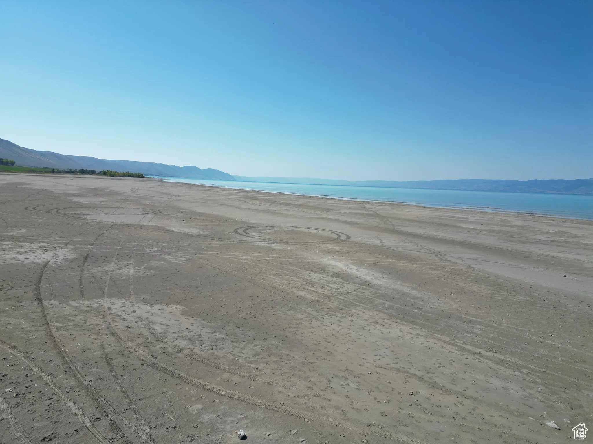 RV lot Bear Lake beach view with a mountain backdrop
