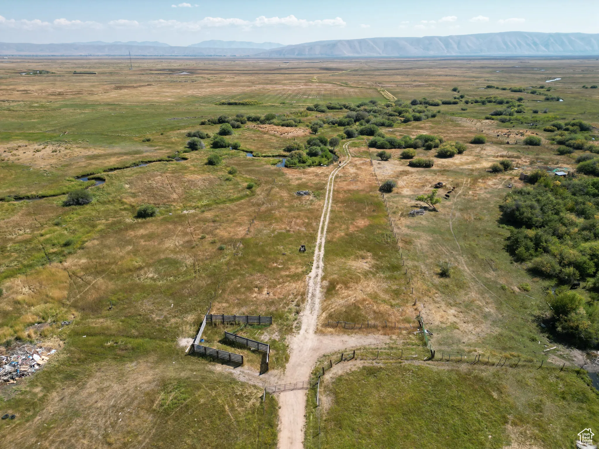 Bloomington 13 acres Aerial view of property and surrounding area featuring rural landscape and a mountain backdrop