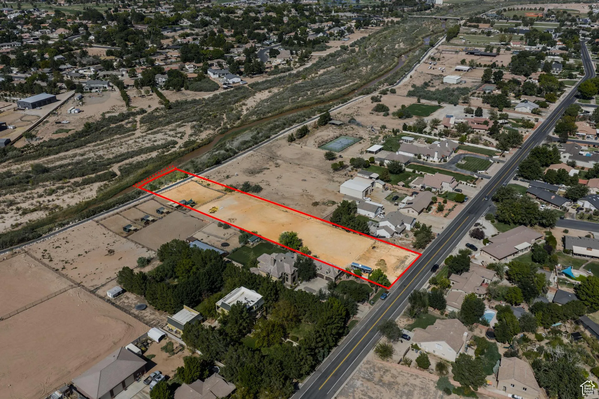 Aerial view of residential area with property boundaries highlighted