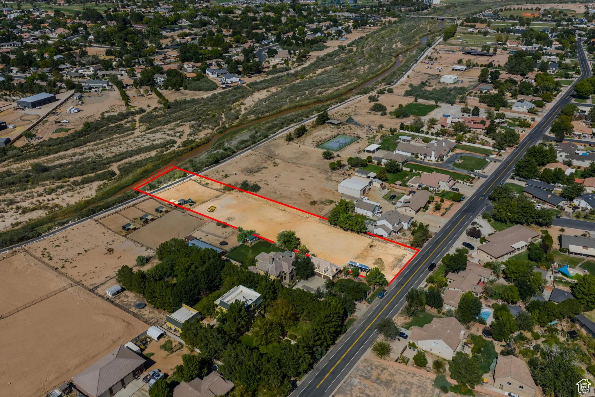 Aerial view of residential area with property parcel outlined