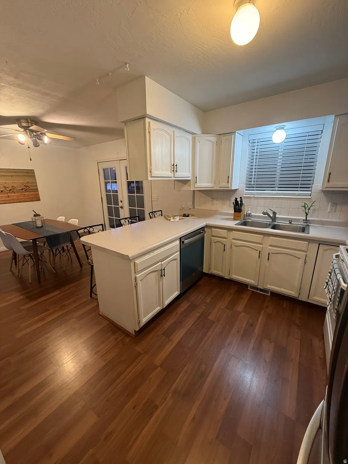Kitchen with a peninsula, brand new stainless dishwasher! Also comes with large stainless Refrigerator.