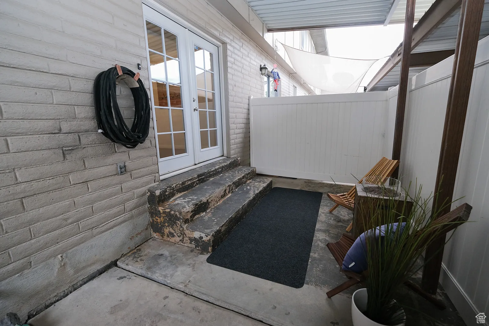 Back doors to patio and owner parking.