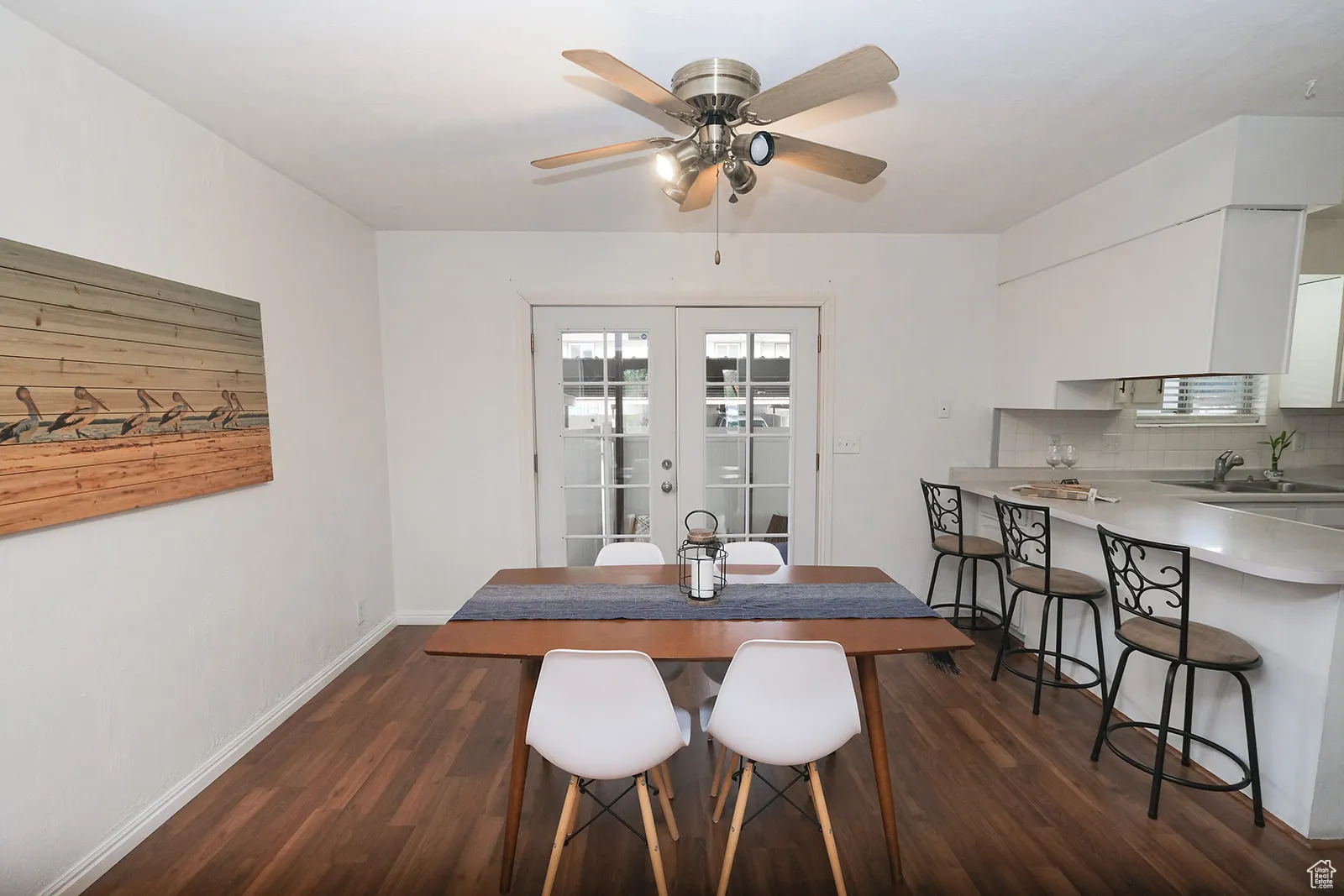 French doors to back patio and covered parking.