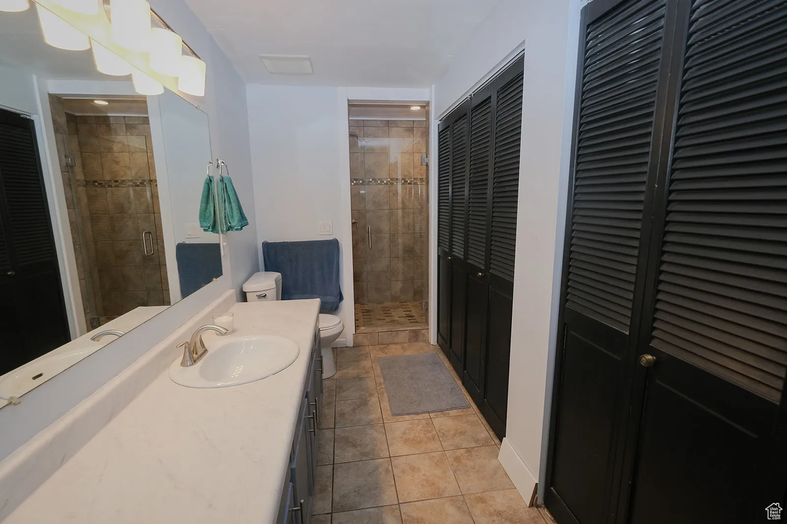 Primary Bathroom with extra length vanity and double closets.