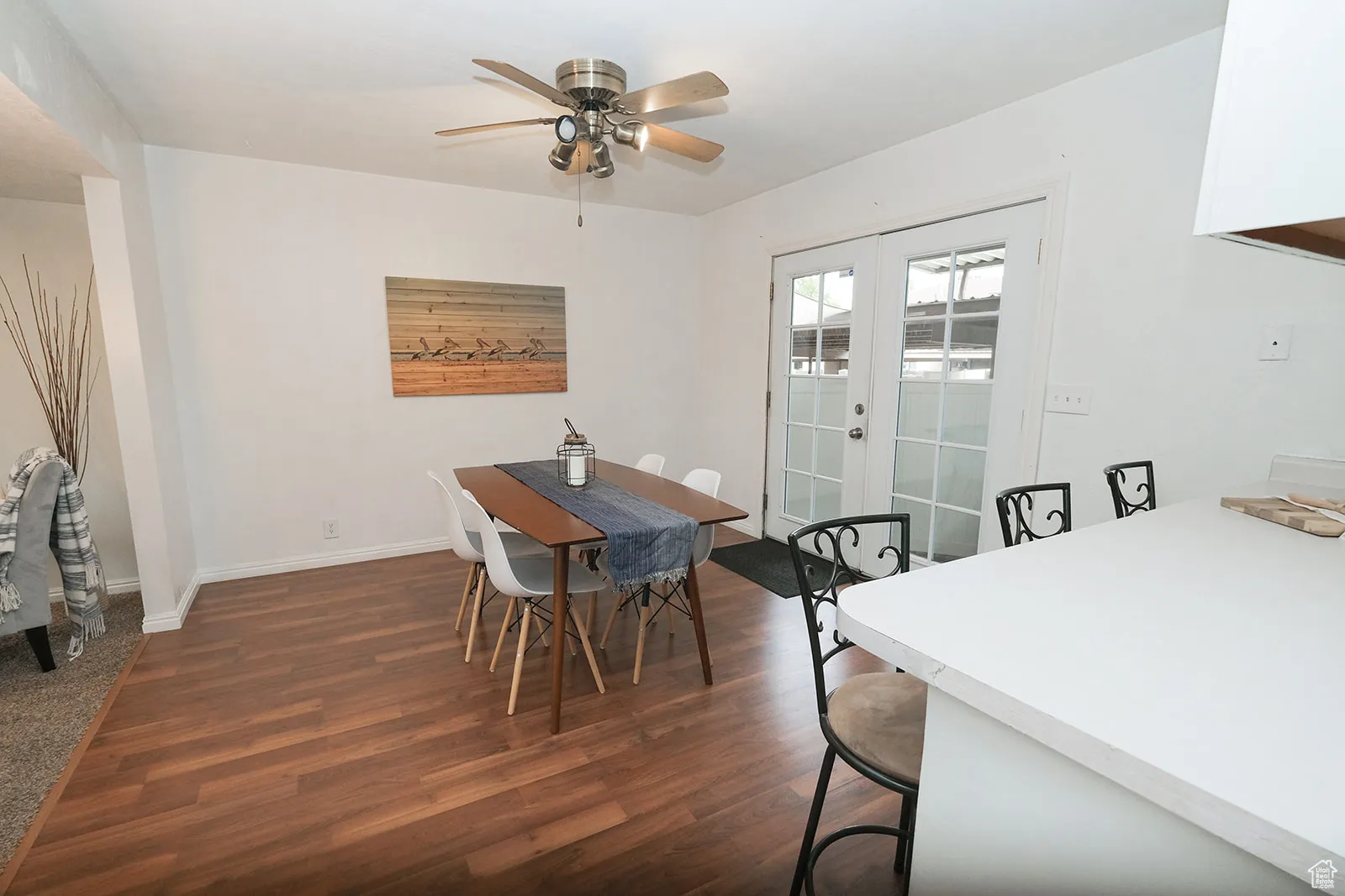 French doors to back patio and covered parking.