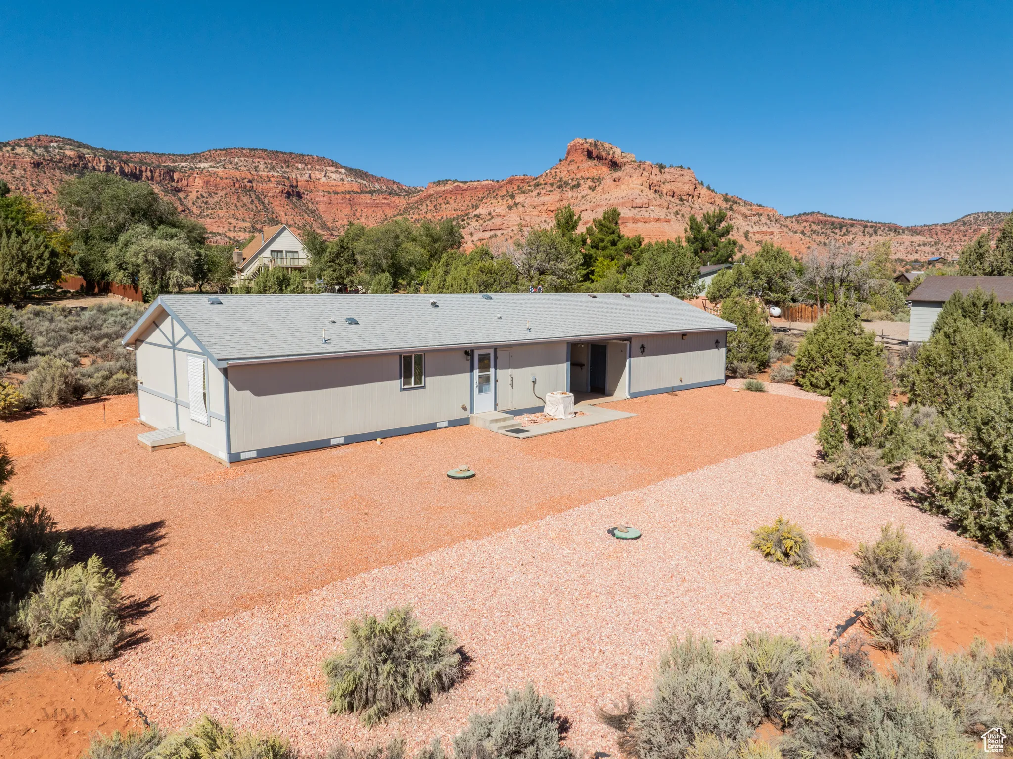 Rear view of property with a mountain view