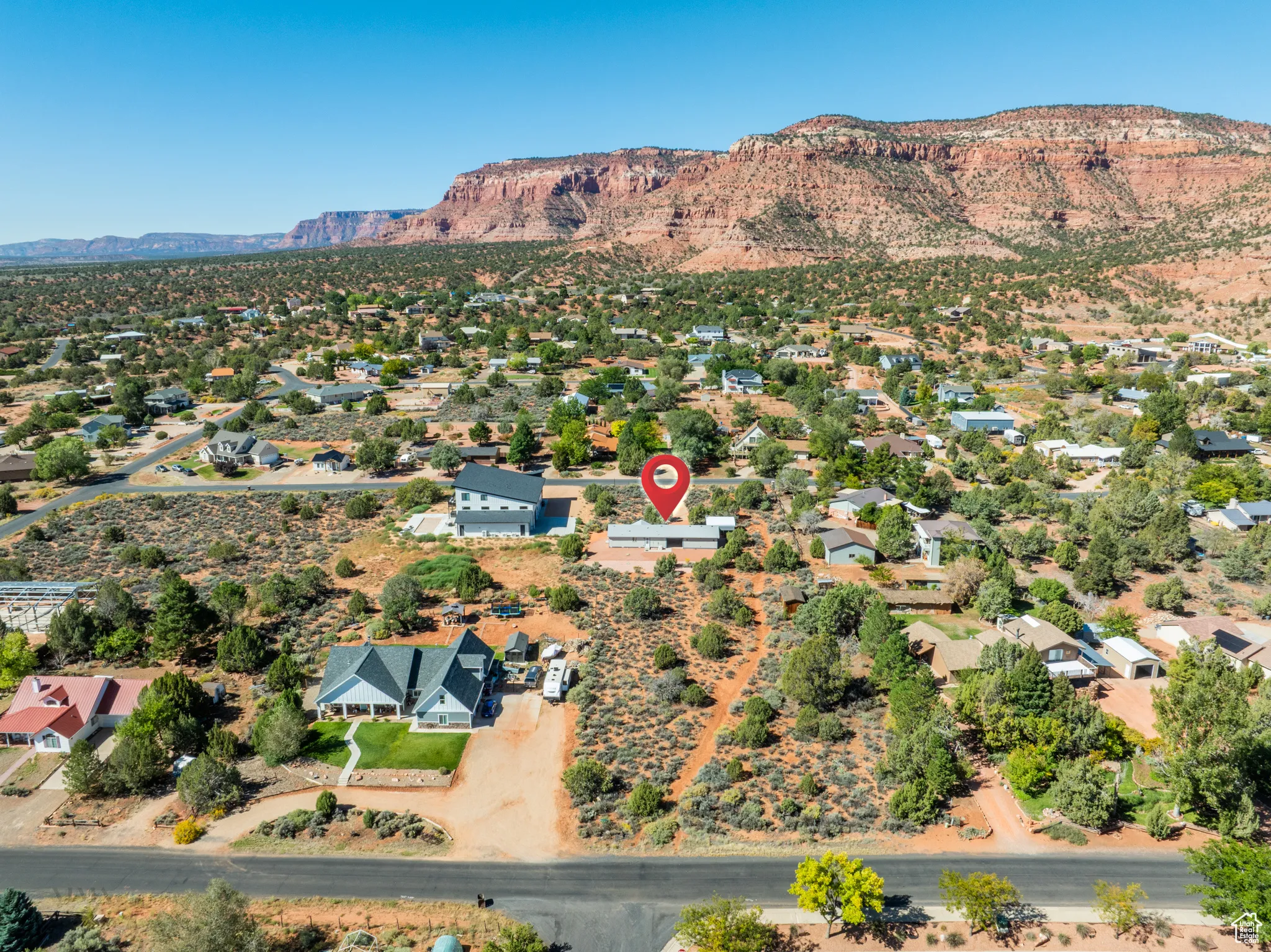 Aerial overview of property's location with mountains