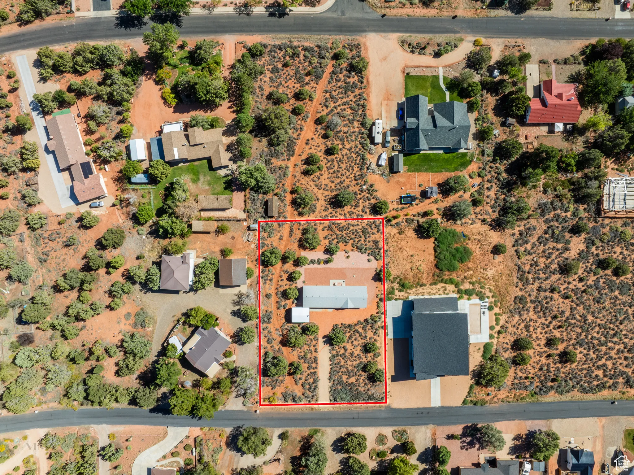 Aerial overview of property's location featuring property boundaries highlighted and a desert landscape
