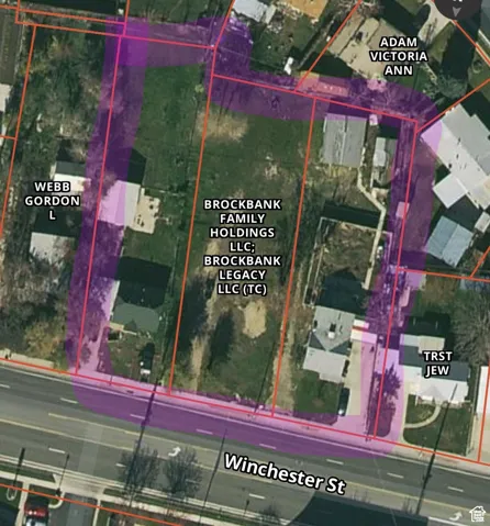 Aerial map of property and surrounding area featuring property parcel outlined