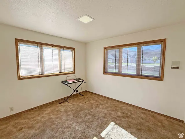 Office off the family room with attached half bath.