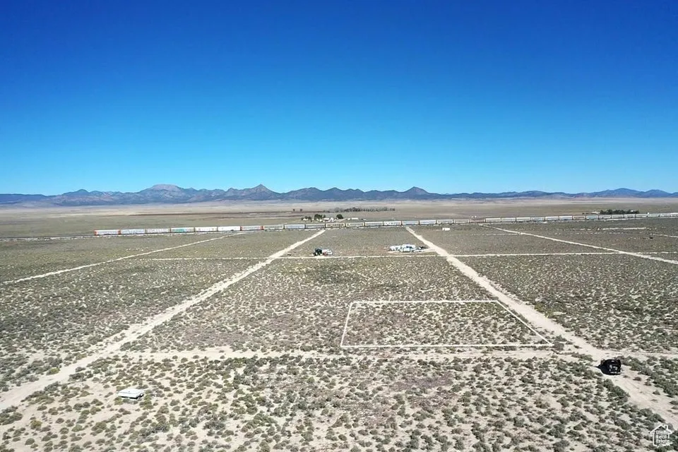 Aerial view of sparsely populated area with a mountainous background