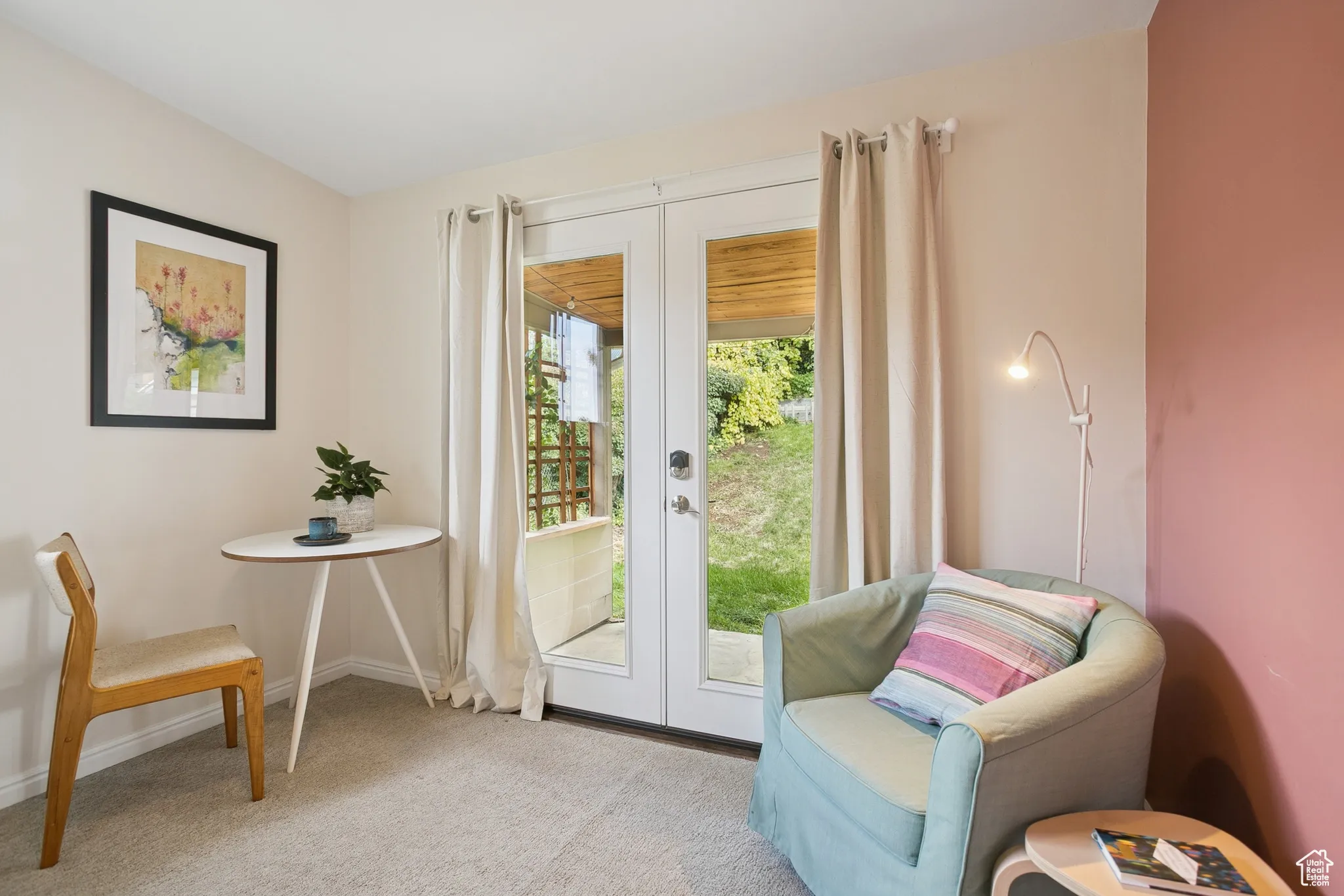 Doorway to outside with french doors and carpet flooring