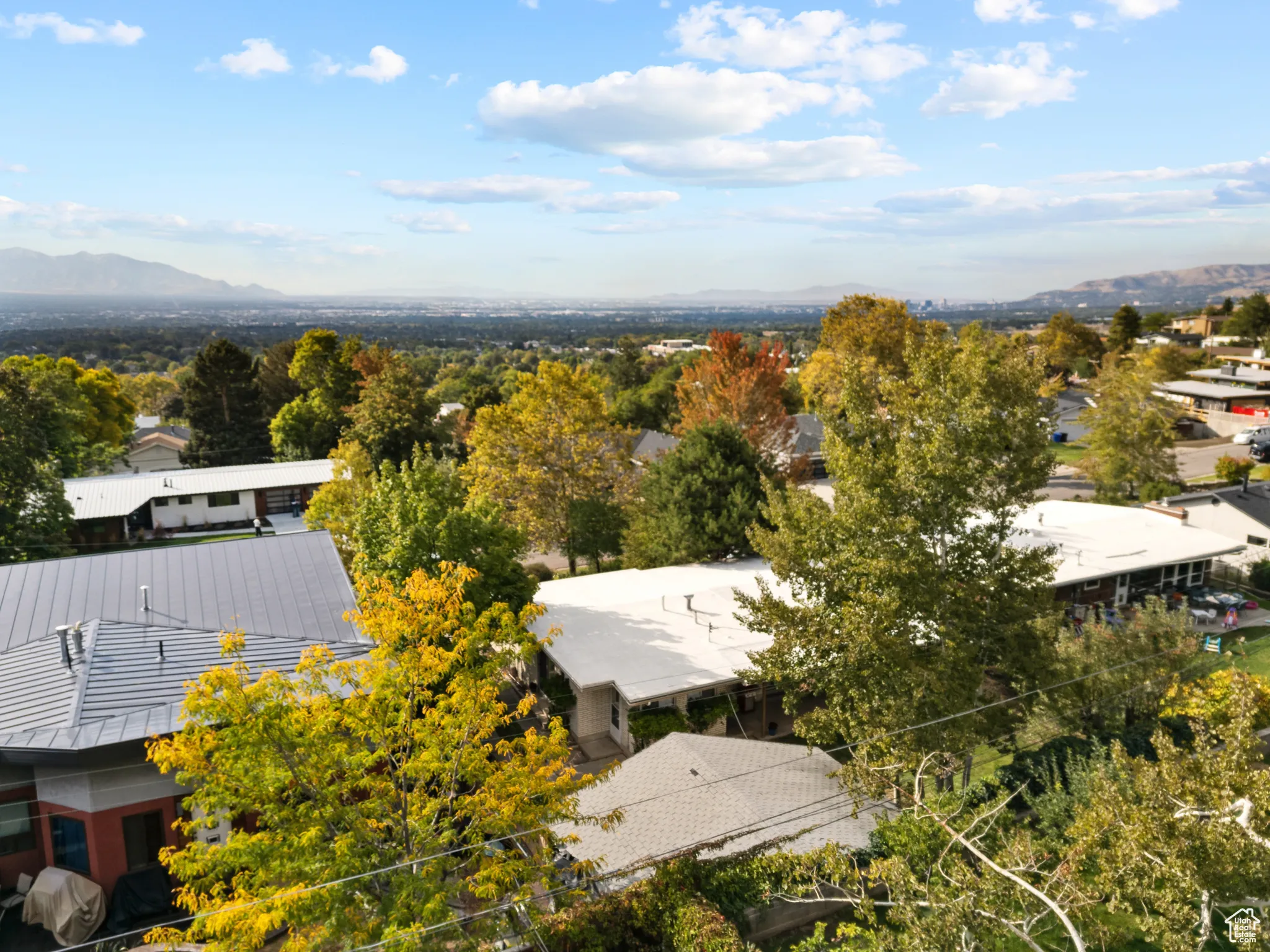 Aerial view of residential area featuring a mountainous background