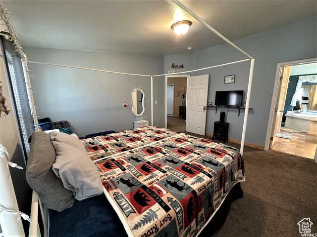 Carpeted bedroom with baseboards