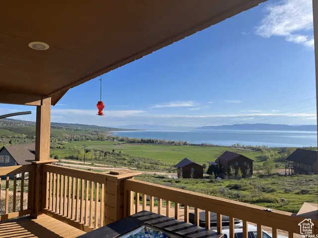 Wooden terrace with a water view and a rural view