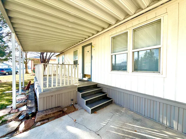 Property entrance featuring covered porch