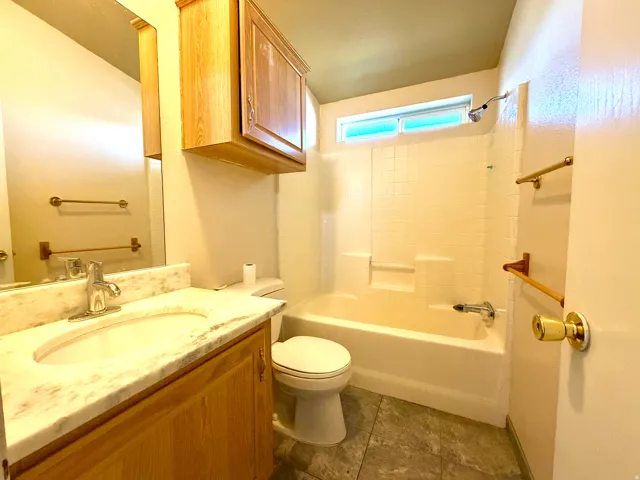 Bathroom featuring vanity and bathtub / shower combination