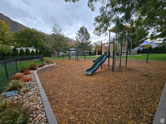 Communal playground featuring a mountain view