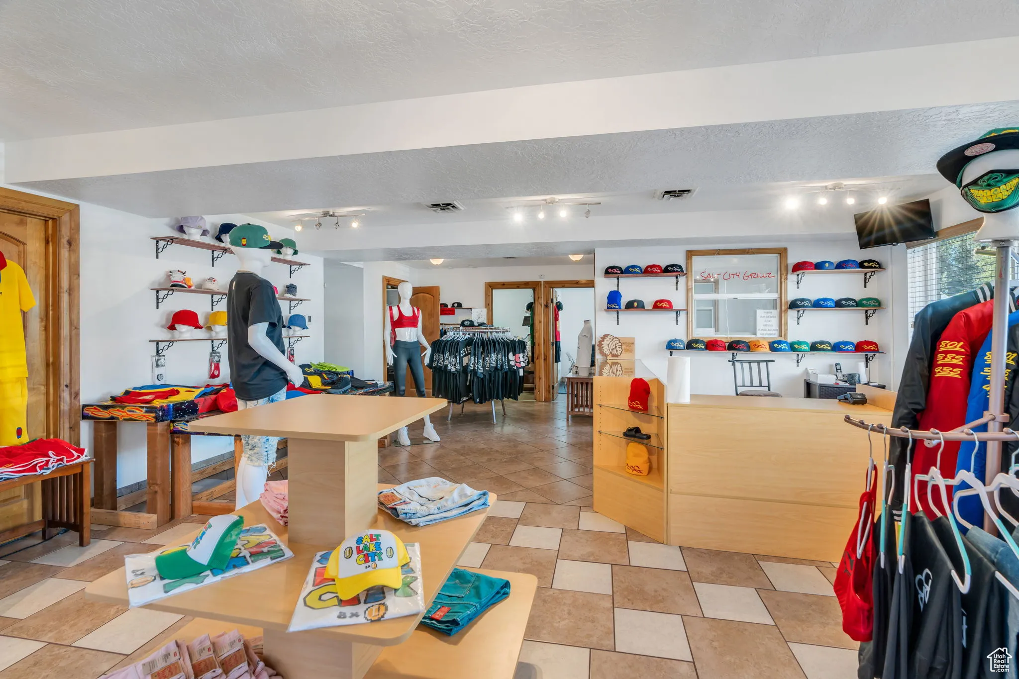 Misc room featuring rail lighting and a textured ceiling