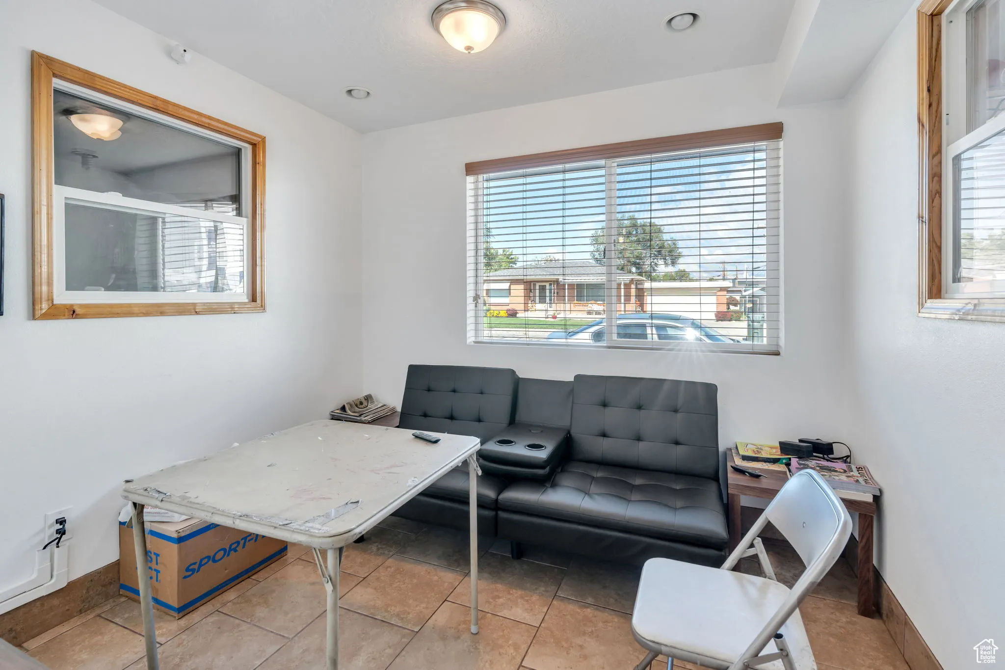 Home office featuring baseboards and light tile patterned floors