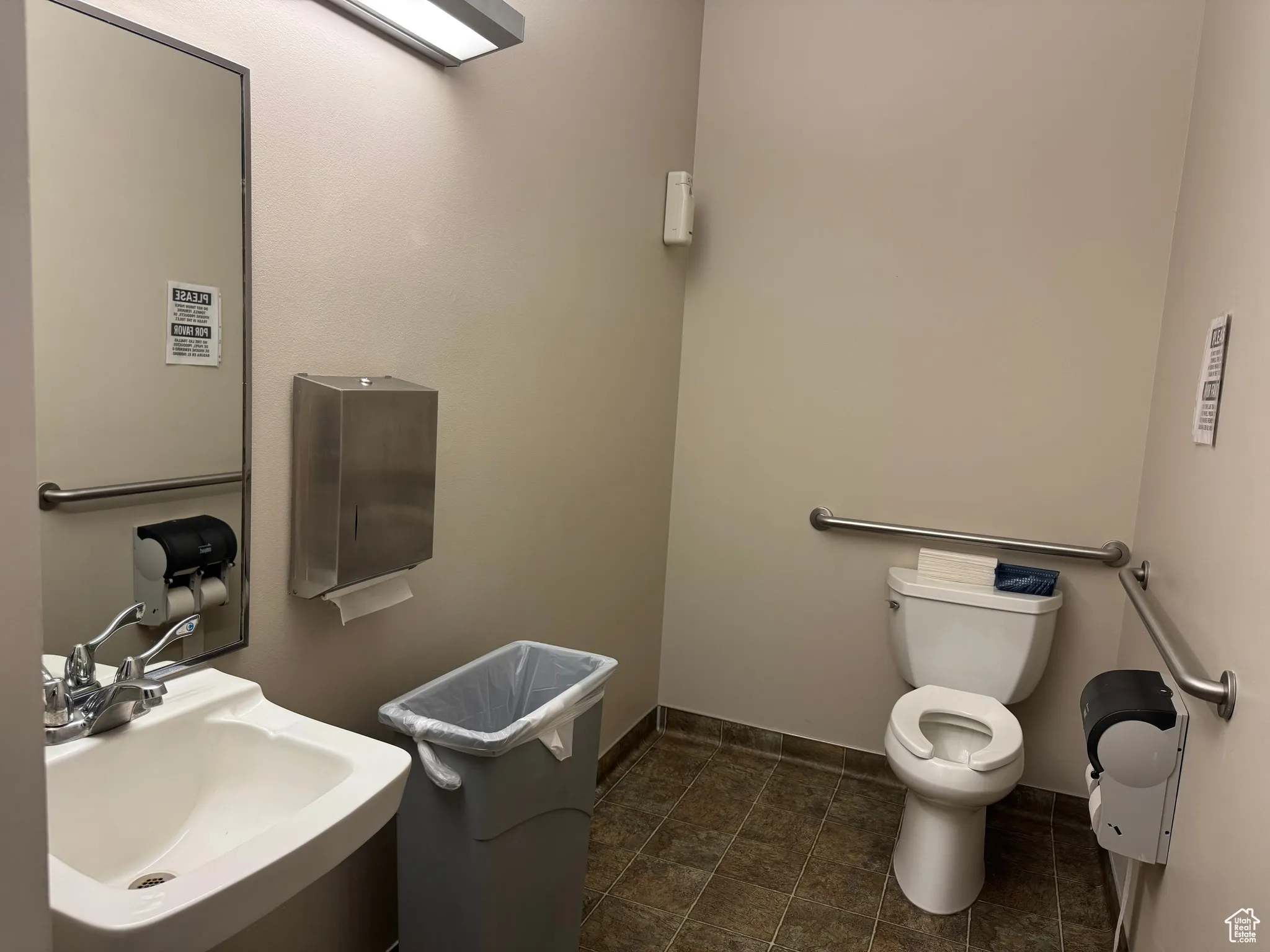 Half bath with toilet and a sink