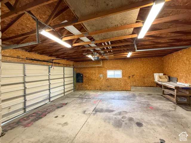 Garage featuring a garage door opener