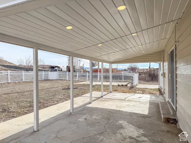 Fenced backyard featuring a patio area
