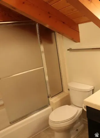 Bathroom with vanity, bath / shower combo with glass door, wood ceiling, and tile patterned floors