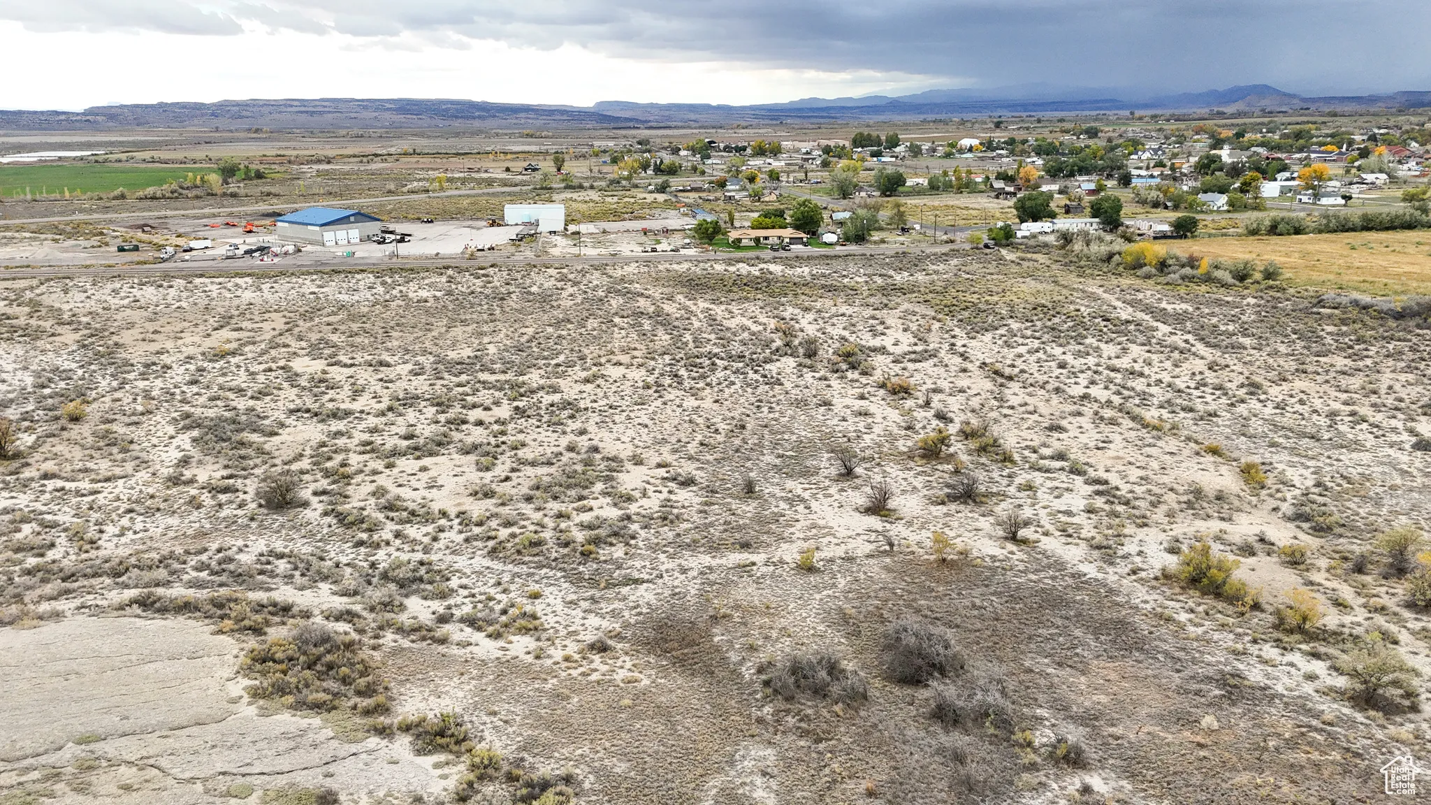 View of rural area featuring mountains and a desert landscape