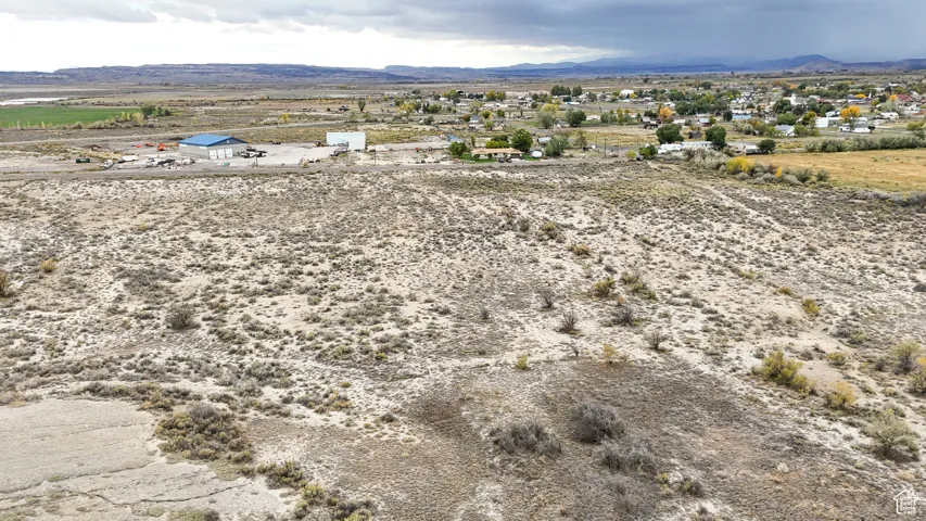 View of rural area featuring mountains and a desert landscape