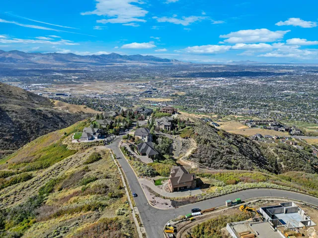Aerial view of residential area featuring a mountainous background