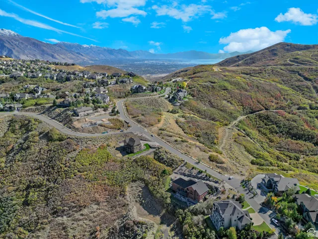 View of property location featuring a mountainous background and nearby suburban area
