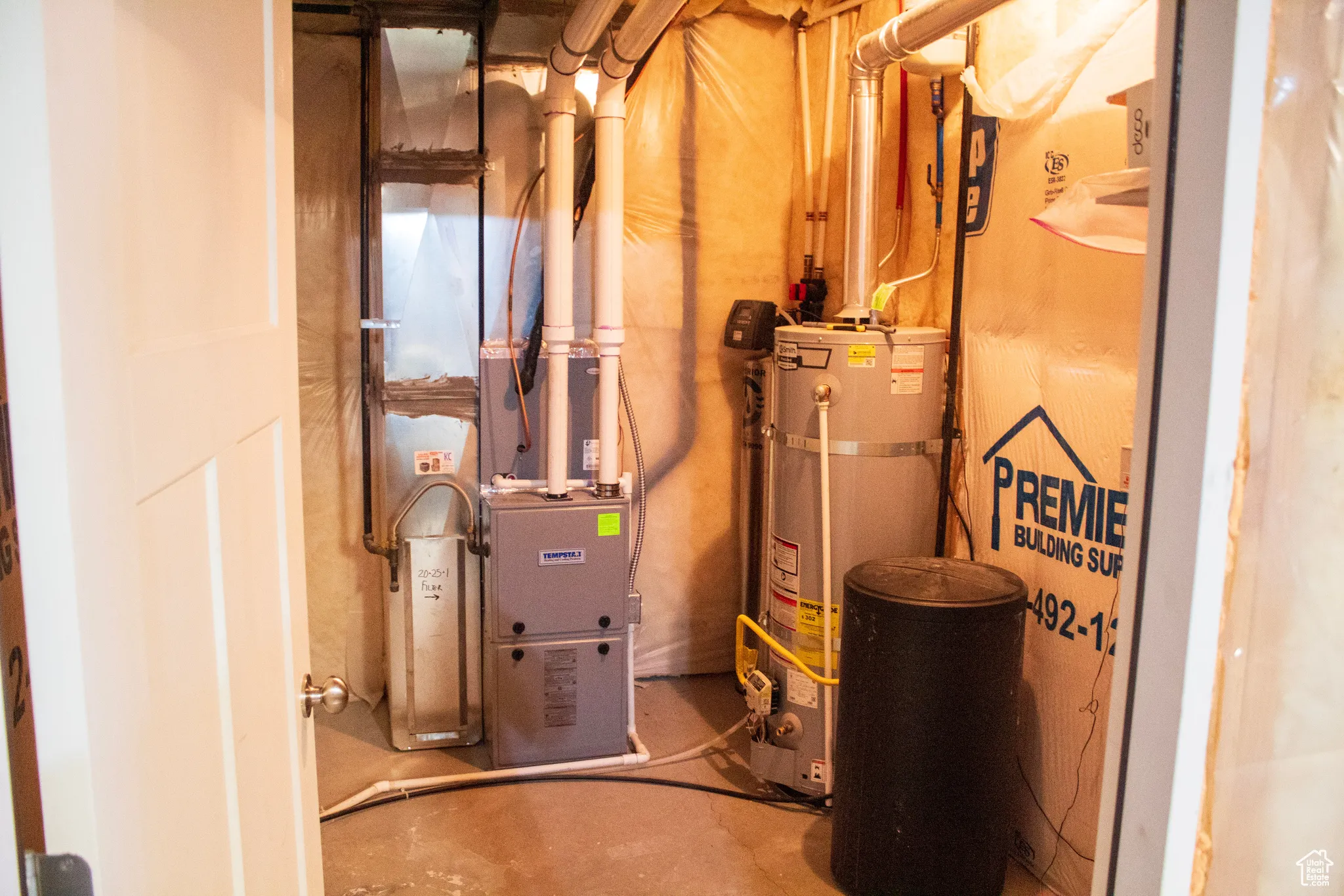 Utilities featuring water heater and heating unit