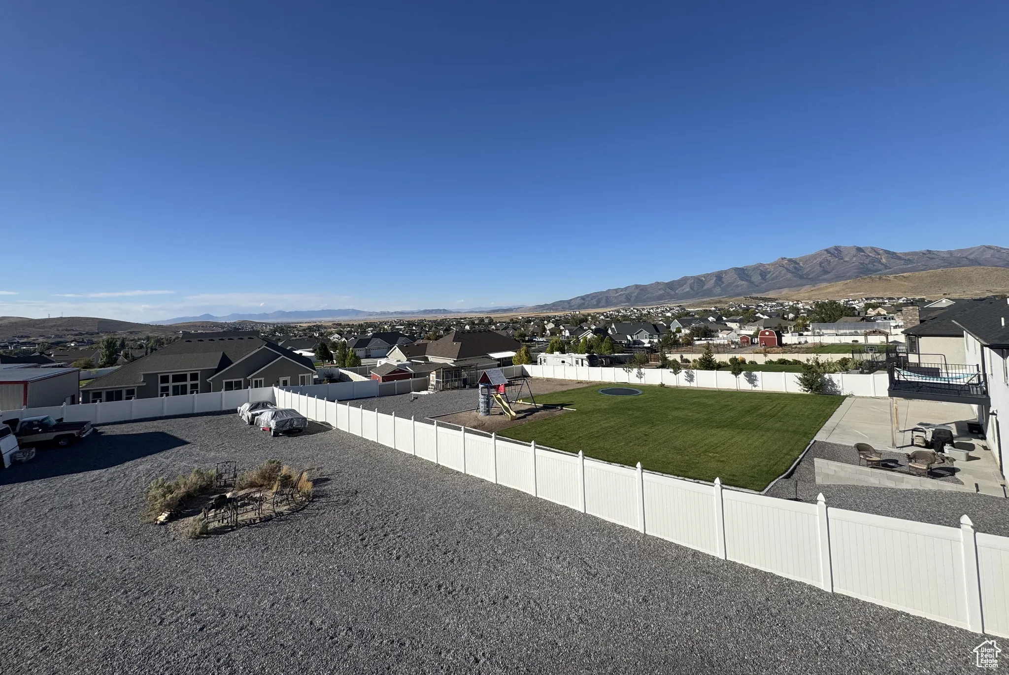View of mountain background featuring nearby suburban area