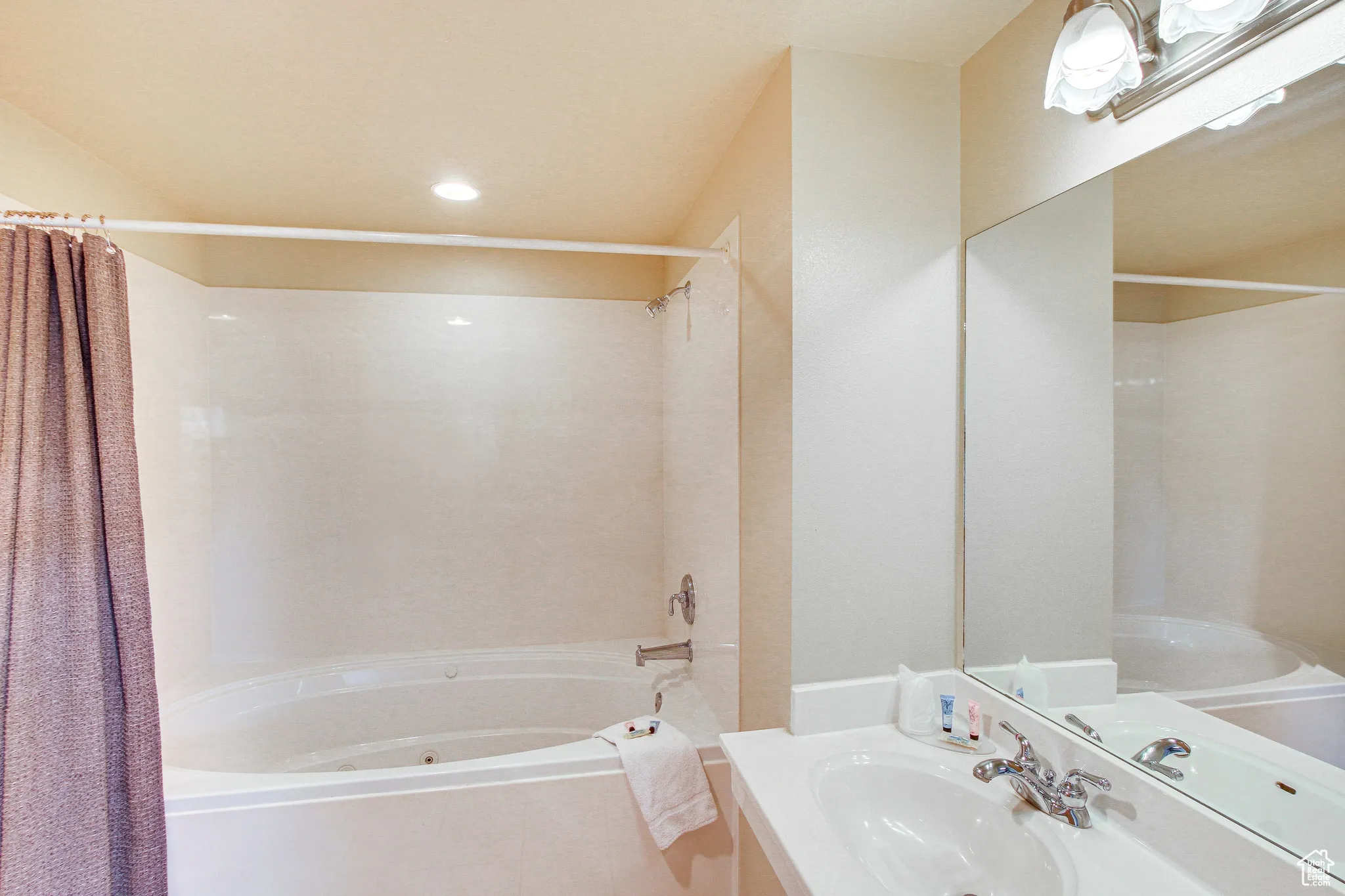 Bathroom featuring shower / tub combo, vanity, tile patterned floors, and recessed lighting