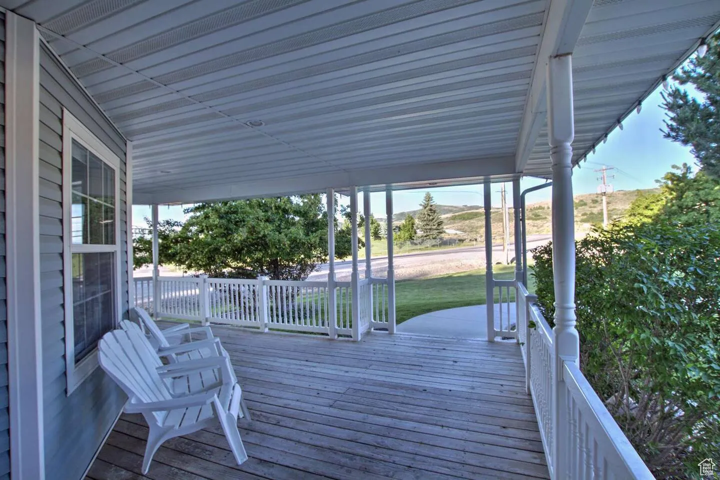 Wooden porch with a lawn