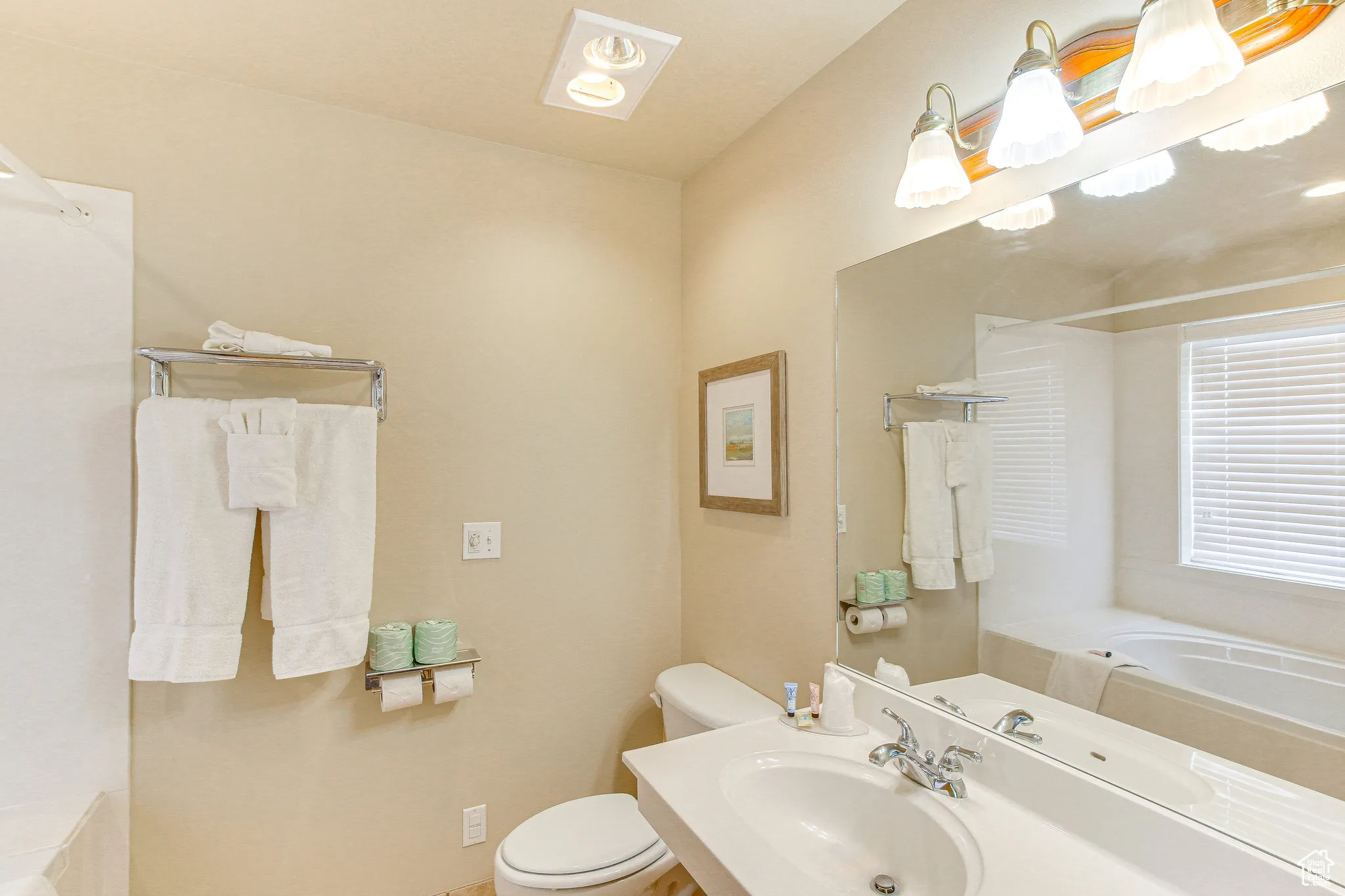 Bathroom featuring toilet and vanity