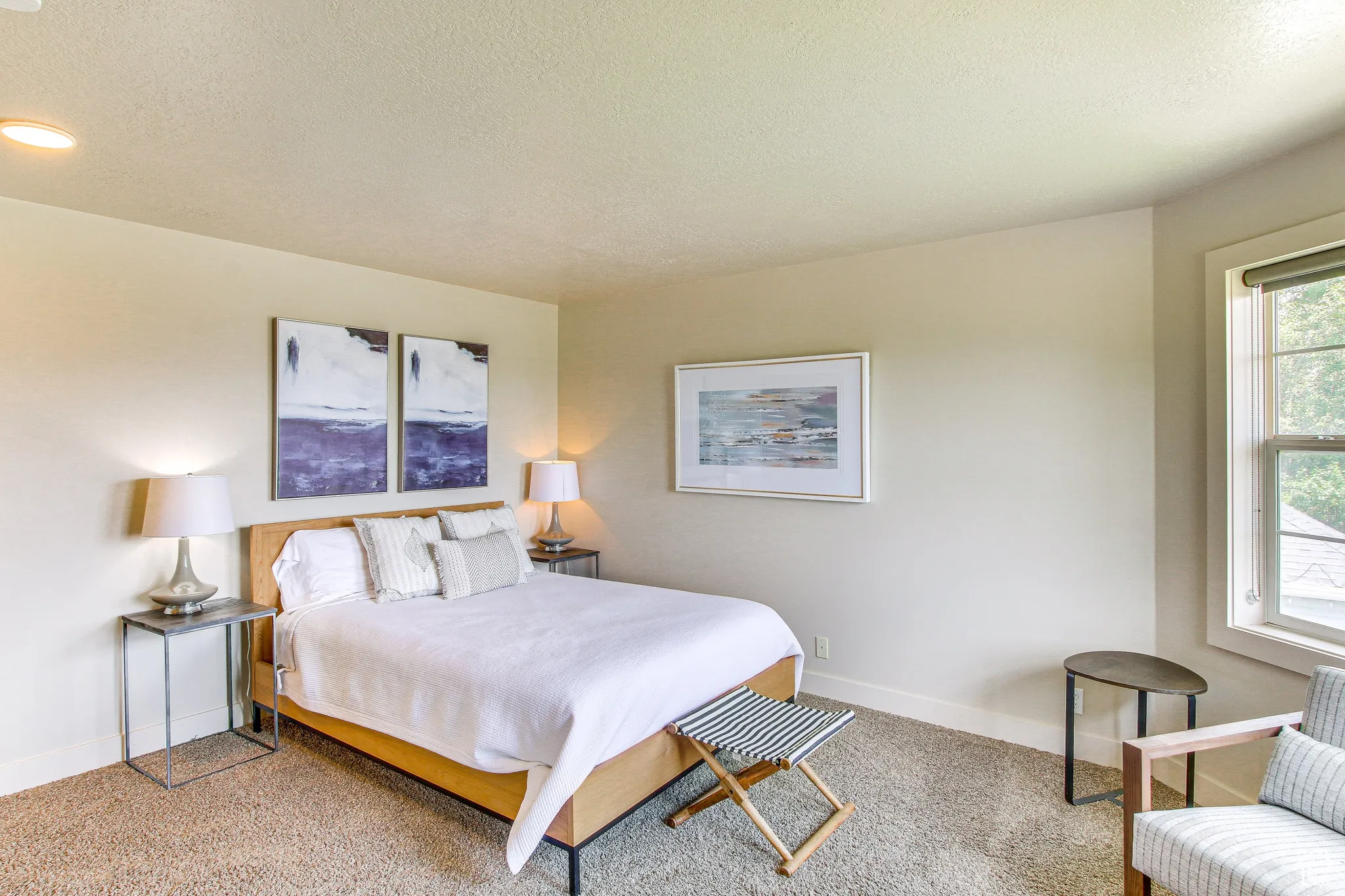 Bedroom featuring a textured ceiling and carpet floors